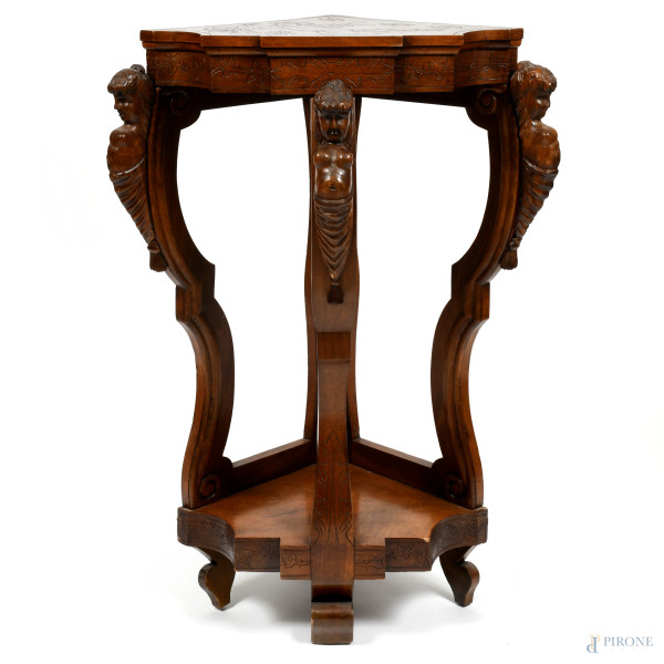 Consolle ad angolo in noce intagliata con polene alle gambe e putto inciso al piano, XIX-XX secolo, cm 110x74x57 circa, (segni di usura, scalfiture, difetti)