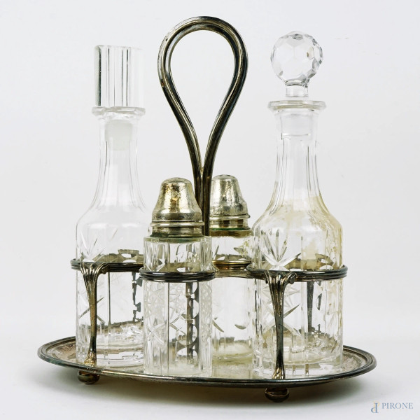 Set olio aceto in argento, ampolle in cristallo controtagliato, cm h 23,5, metà XX secolo, peso gr. 476, (difetti, un tappo non pertinente)