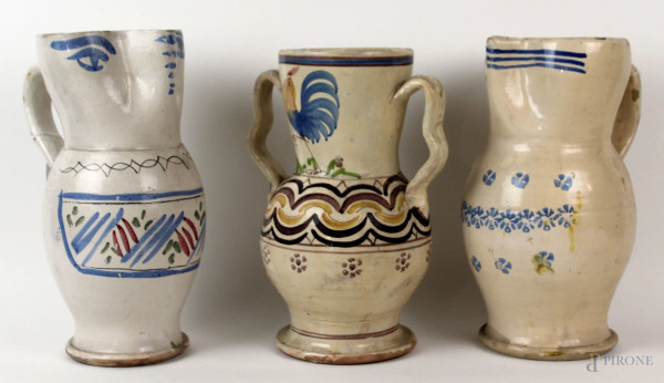 Lotto di due versatoi ed un vaso biansato in ceramica policroma, Puglia, XX secolo, alt. max cm 29, (difetti).