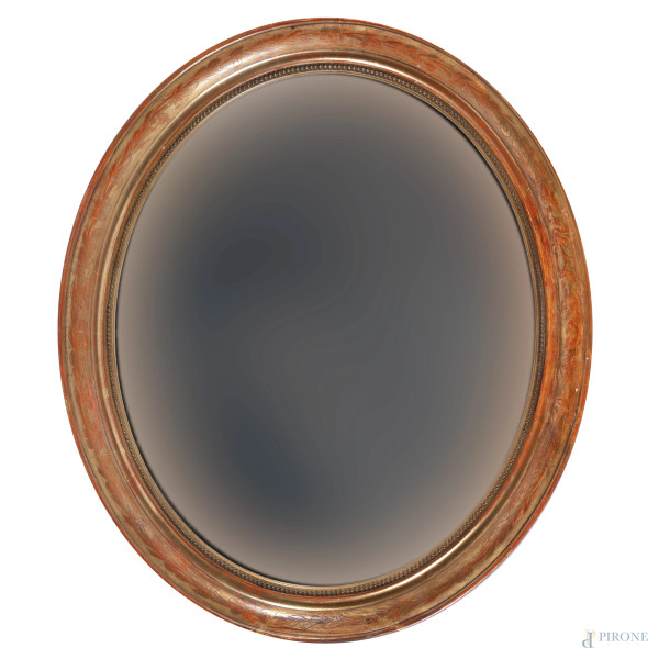 Specchiera a serto ovale in legno dipinto e dorato, XX secolo, cm 77,5x55,5, (segni di usura, scalfiture, cadute di doratura)