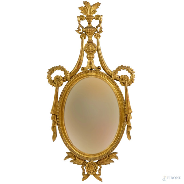 Specchiera in legno dorato ed intagliato, XIX secolo,  cimasa intagliata a traforo e motivi floreali, cm h 125x62, (difetti)