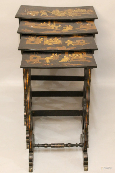 Nido di quattro tavolinetti in legno ebanizzato a decoro di scene di vita orientale,XIX sec.,h 77x59x37 cm.