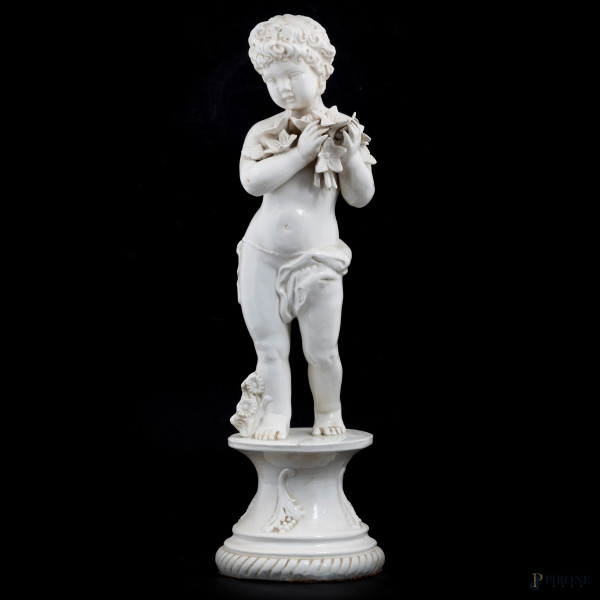 Putto in porcellana bianca, XX secolo, altezza cm 55, (segni di usura, felature, crettature superficiali, sbeccature)
