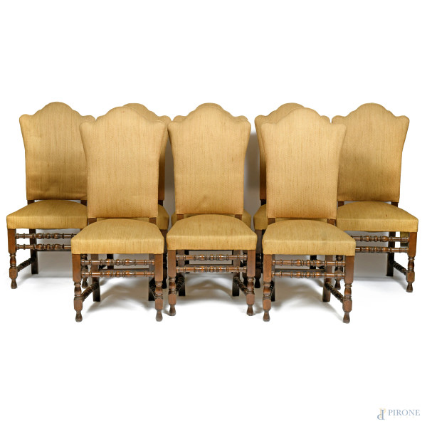 Lotto composto da 8 sedie in noce rivestite in stoffa color ocra, XX secolo, cm 117x50x45(segni di usura, difetti, fori di tarlo)
