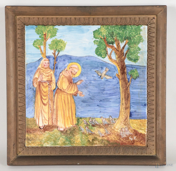 Mattonella in maiolica smaltata dipinta in policromia con rappresentazione di San Francesco, XX secolo, cm 20x20, siglato in basso a destra, entro cornice