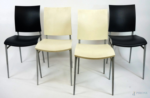 Sei sedie Coco Cassina, struttura in metallo satinato, sedute e schienali in materiale plastico di colore nero, bianco, arancio e giallo, cm h 80, (difetti)