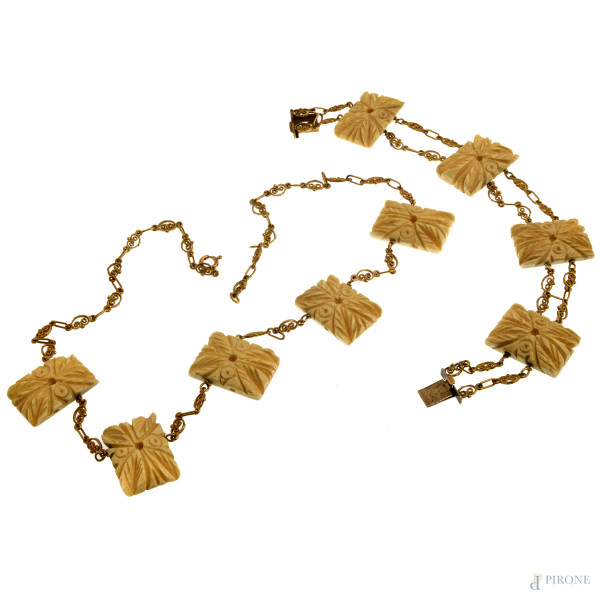 Parure composta da bracciale e collana in oro basso e osso, XX secolo, lunghezza collana cm 47, peso complessivo lordo gr 59, (segni di usura, lievi scalfiture)