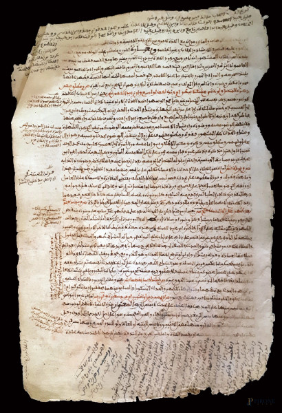 Antico manoscritto persiano in caratteri arabi vergati a inchiostro bruno e lacca rossa, (macchie e difetti).