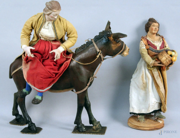 Lotto composto da due personaggi da presepio napoletano in terracotta e legno, met&#224; XX sec, h. 38 cm.
