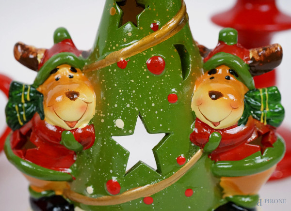 Lotto composto da sette portacandele natalizi, in materiali diversi, alt. cm 18, (lievi difetti)