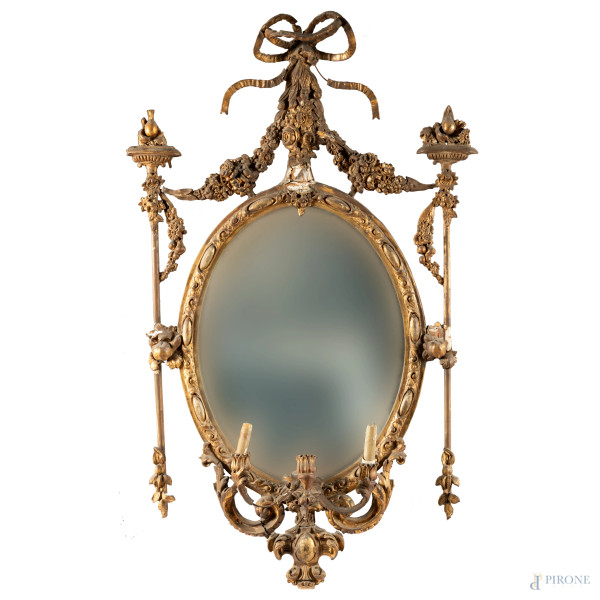 Coppia di specchiere ovali in legno e stucco dorato, XIX secolo, cm 116x62 (rotture, mancanze, di...