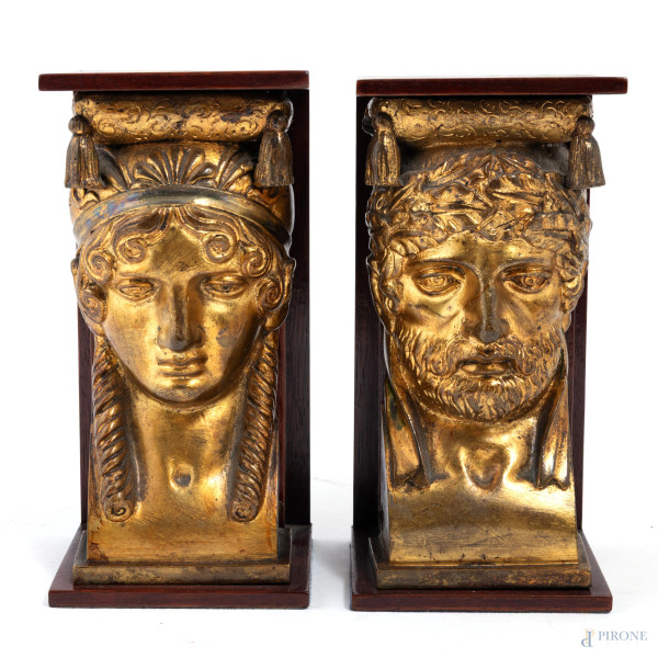 Lotto di due fermalibri in legno e metallo dorato, XX secolo, altezza cm 16, (segni di usura)