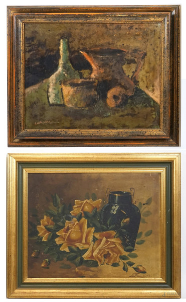 Lotto di due nature morte con vasellame, olio su tela, misure max cm 40x50, firmati, entro cornici, (difetti sulla tela).