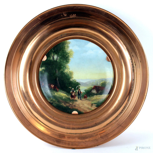 Piatto in porcellana Limoges, raffigurante paesaggio con contadini, montatura in rame, diametro cm. 45, XX secolo.