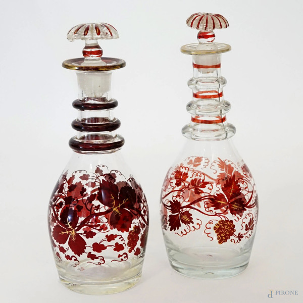 Due boccette in vetro con decori rosso rubino, alt.max cm 21, XX secolo, (lievi difetti).