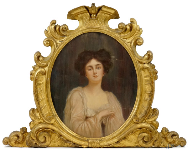 Coppia di importanti cornici in legno dorato del XIX secolo, con due pastelli ad assetto ovale ra...