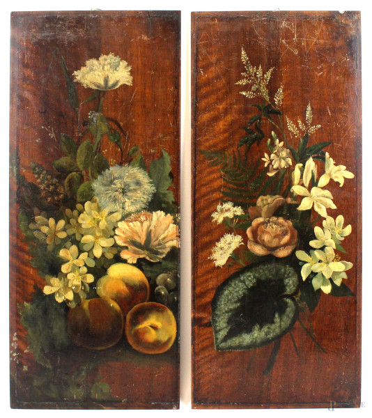 Coppia di dipinti raffiguranti fiori, olio su tavola, cm 57x24,5, prima metà XX secolo, (difetti).