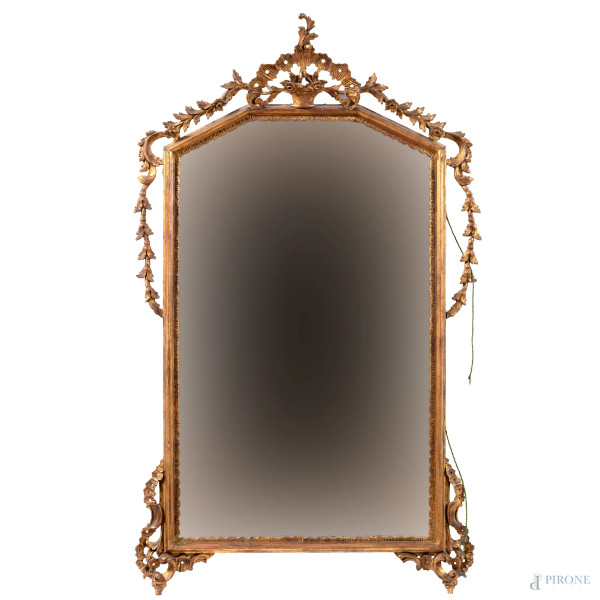 Specchiera in legno intagliato e dorato, XX secolo, cm 132,5x80, (segni di usura, scalfiture, difetti)