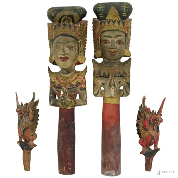 Quattro sculture in legno intagliato e dipinto, lunghezza max cm 34, Thailandia, XX secolo, (difetti).