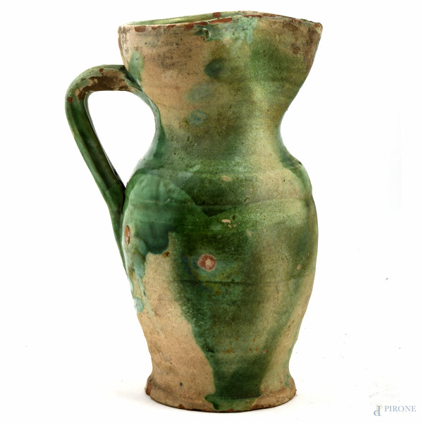 Versatoio in maiolica nei toni del verde, XX secolo, altezza cm 23, (sbeccature, mancanze, cadute di smalto stannifero, segni di usura)