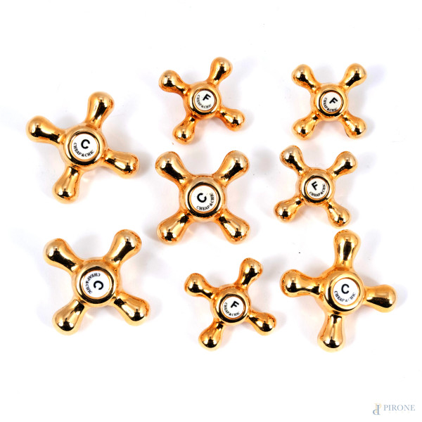 Lotto composto da 8 bottoni Moschino vintage, cm 5x5, (segni di usura)