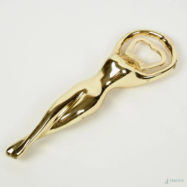 Apribottiglia a forma di nudo di donna in metallo dorato, lunghezza cm 18, firmato, (lievi difetti).