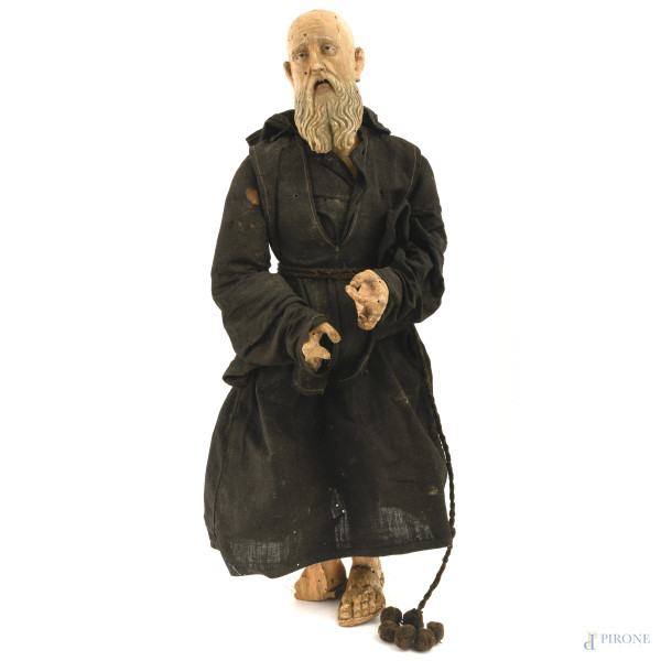 Scultura di santo in legno policromo con articolazioni mobili e veste in tessuto, prima metà XX secolo, altezza cm 50 ca., (difetti, rotture e mancanze)