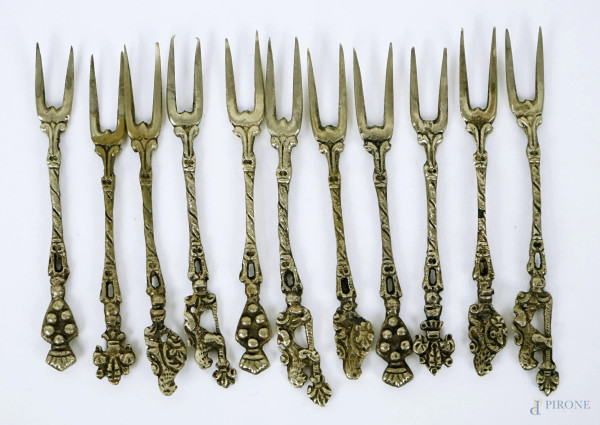 Undici forchettine in metallo argentato, lunghezza cm 9, XX secolo.