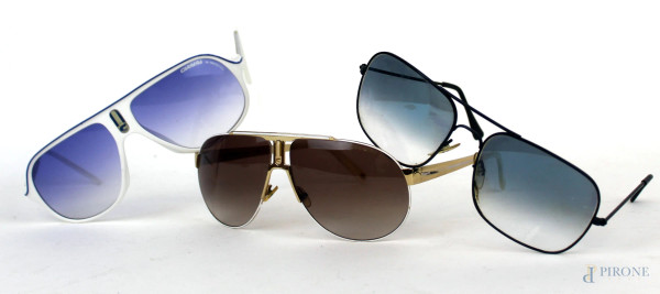 Lotto composto da due occhiali da sole Carrera a lente scura ed un occhiale vintage, (segni di utilizzo). 