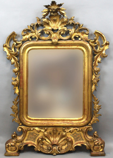 Specchiera in legno intagliato e dorato, fine XVIII-inizi XIX secolo, cornice scolpita a volute e foglie, cm h 144x98
