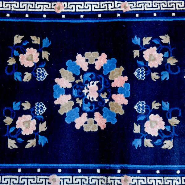 Lotto di quattro tappeti, cm 70x144; cm 92,5x159; cm 61x94; cm 71x147, (difetti)