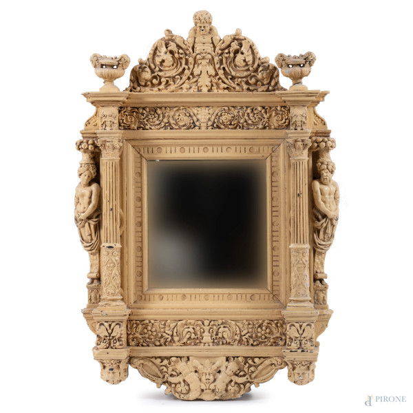 Specchiera in legno decorata in stucco dipinto a finto avorio con ricca decorazione architettonica a colonne , telamoni e elementi fitomorfi, XX secolo, cm 116x75, (segni di usura, scalfiture, restauri, difetti)