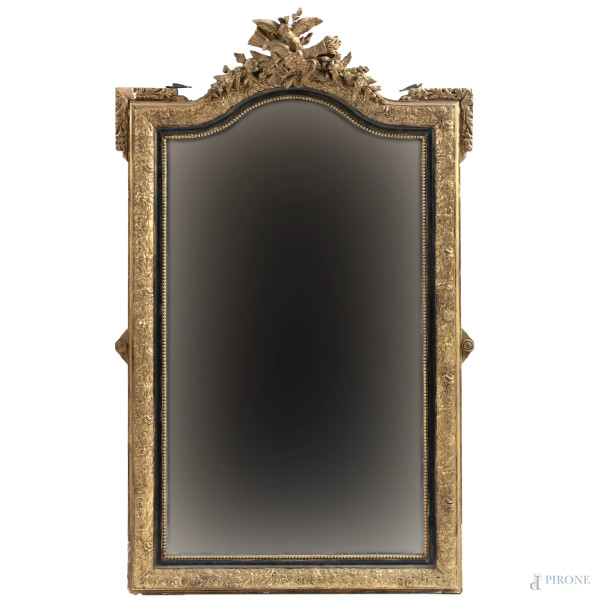 Specchiera in legno intagliato, dipinto e dorato a volute vegetali, floreali e volatili, XIX-XX secolo, cm 144x89, (segni di usura, perdita di doratura, rotture, mancanze, restauri, difetti)