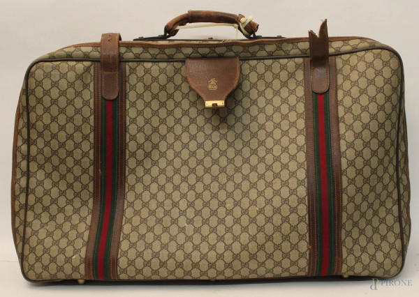 Lotto composto da due valigie in cuoio e tessuto firmate Gucci, anni &#39;50.