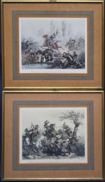 Coppia di stampe raffiguranti scene di battaglia, cm 27 x 32, entro cornici.