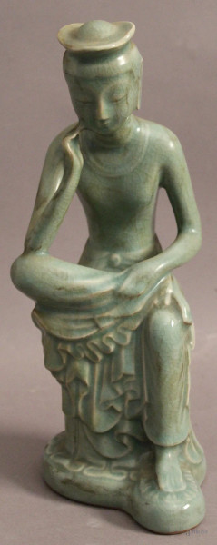 Santone, scultura in porcellana marcata, H 29 cm.