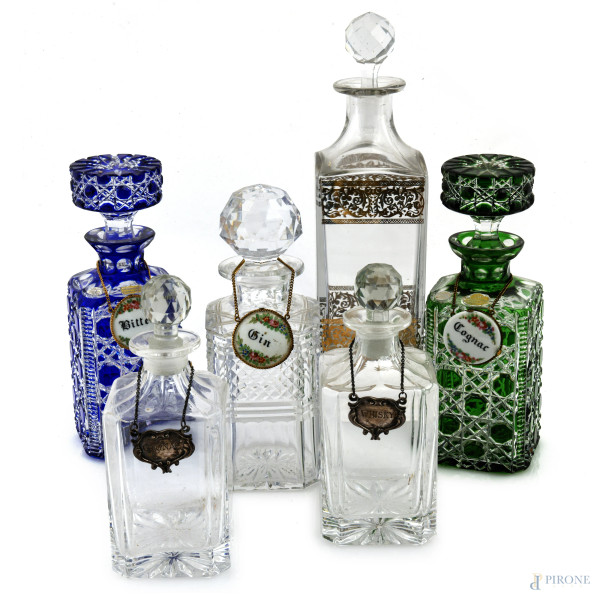 Lotto composto da 6 bottiglie in cristallo e vetro di varia foggia, XX secolo, altezza massima cm 28,5, ( sbeccature, segni di usura)