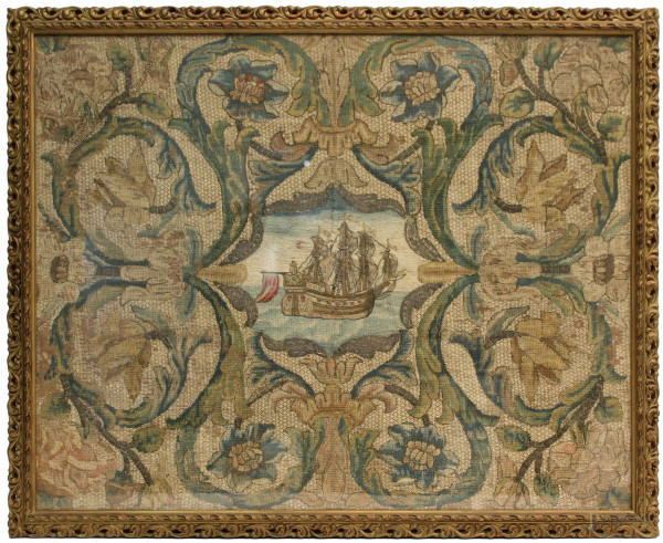 Arazzo, a motivi di foglie d&#39;acanto e fiori con riserva centrale, raffigurante veliero,XVIII sec., cm. 62x77, entro cornice