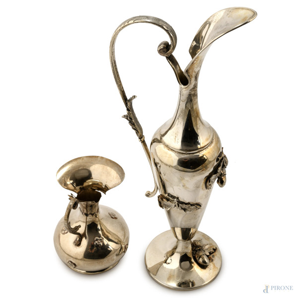 Lotto di due versatoi in argento 800/000, XX secolo, altezza massima cm 30, peso complessivo gr 4...