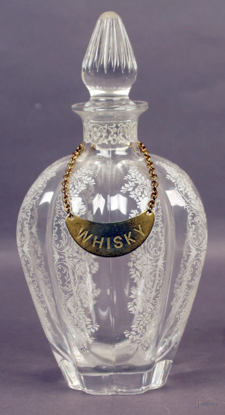 Bottiglia in vetro con decori incisi, primi &#39;900, H 23 cm.