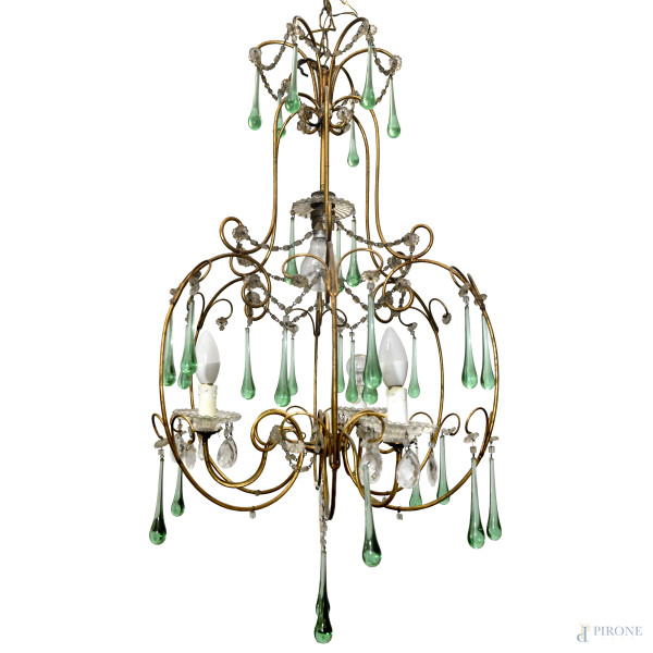 Lampadario con struttura in bronzo dorato a quattro luci, con pendenti in vetro trasparente e verde, XX secolo, cm 96x46 ca, (difetti)