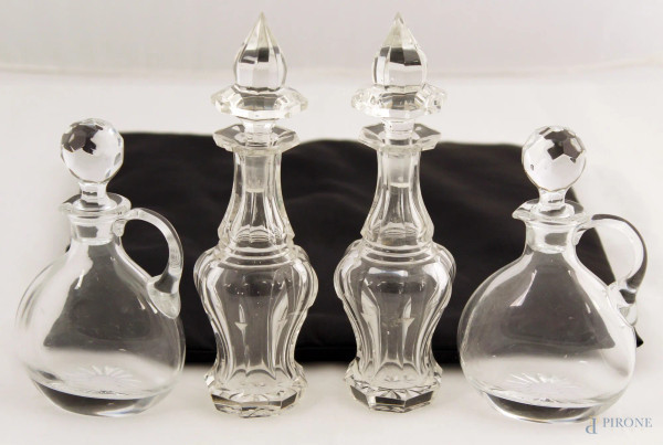 Lotto di quattro oliere in vetro a misure e forme diverse, (uno con difetti)
