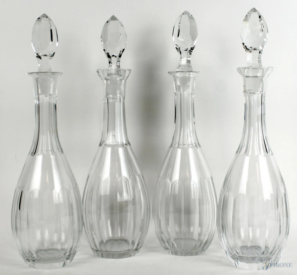 Quattro bottiglie in cristallo, altezza cm 40, XX secolo