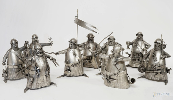 Nove soldatini medievali in metallo argentato, firmati Cycille e Michael Laude, XX secolo, cm h 19,5, (difetti).
