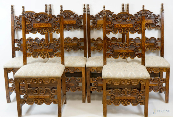 Sei sedie in noce, XIX secolo, particolari scolpiti ed intagliati, sedute in stoffa ricamata beige, cm h 116, (difetti).