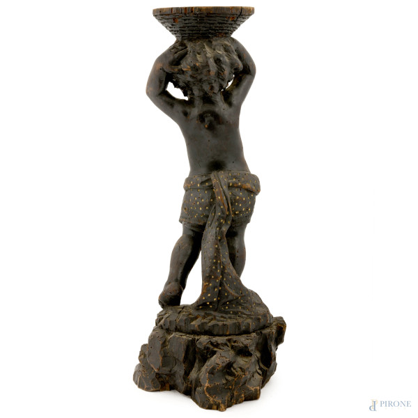Piedistallo a foggia di putto in legno ebanizzato scolpito, XX secolo, cm 73