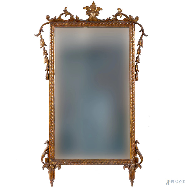 Specchiera in legno intagliato e dorato, XX secolo, cm 106x65, (segni di usura, scalfiture, rotture, restauri)