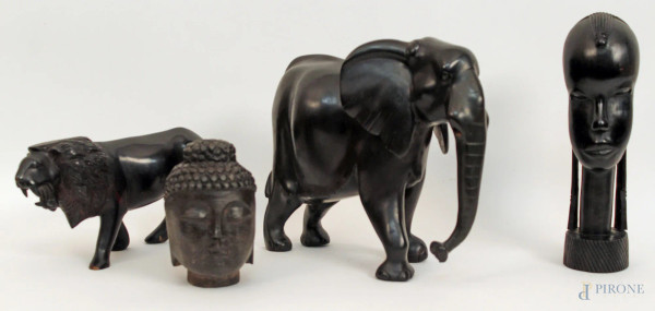 Lotto composto da tre sculture africane in ebano e da una testina orientale, H massima 24 cm.