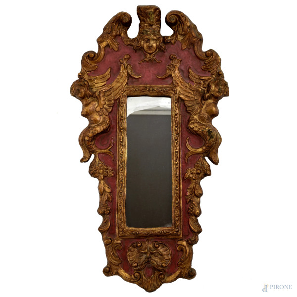 Specchierina in legno laccato e dorato, intagliata a grottesche, cm 59x32,  XX secolo, (usura del tempo)