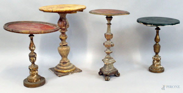 Lotto di quattro tavolini compositi, realizzati con elementi antichi, piani in legno laccato e gambe a candeliere in legno dorato, alt. max cm 56, (difetti)